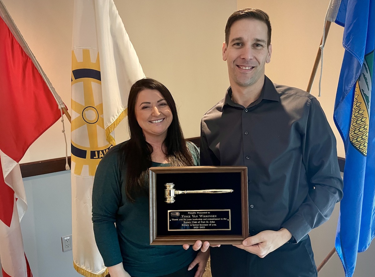 Club President Samantha Warren presents Past President Vince van Wieringen with his Golden Gavel.